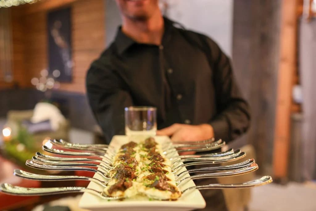 Fine dining catering staff serving appetizers